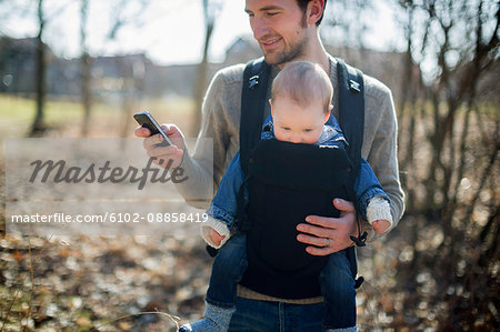 Man with baby boy in carrier