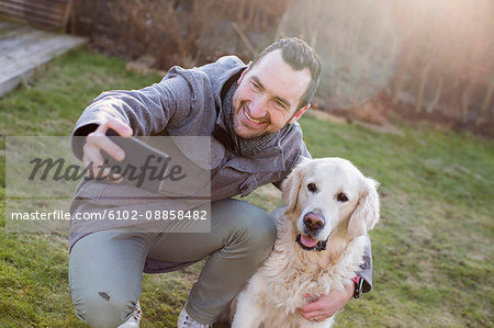 Man taking selfie with his dog