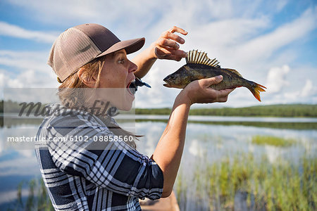 Woman holding fish