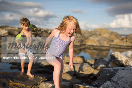 Children on rocky coast