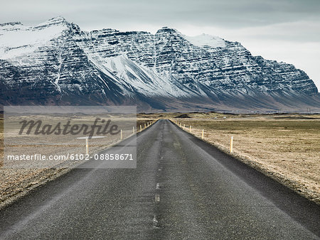 Country road with mountains on background - Stock Photo - Masterfile -  Premium Royalty-Free, Code: 6102-08858671