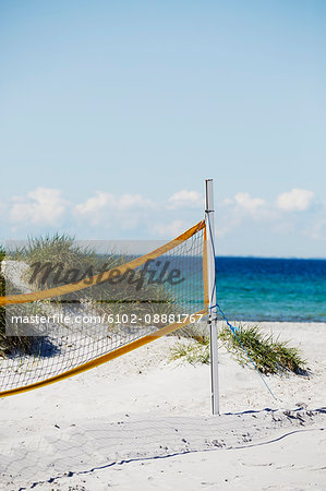 Volleyball net on sandy beach