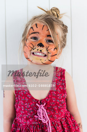 Portrait of girl with painted face