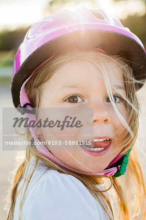 Portrait of blond girl wearing helmet