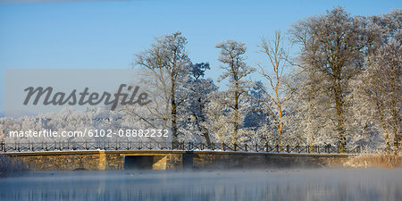 Winter landscape with bridge