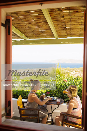 Women relaxing on balcony