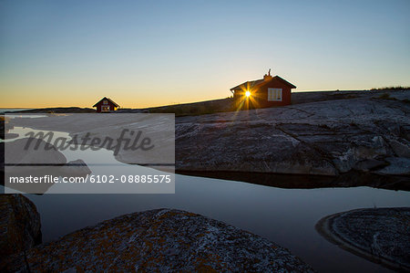 Wooden house on rocky coast