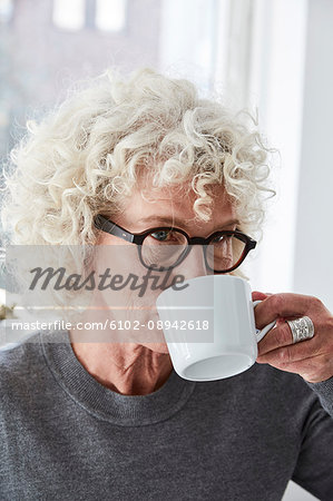 Portrait of senior woman drinking from cup