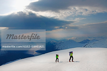 People skiing in winter landscape