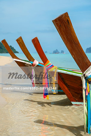 Wooden boat on tropical beach