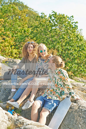 Happy friends sitting together