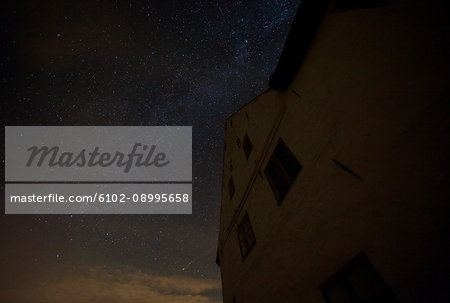 Low angle view of building and starry sky