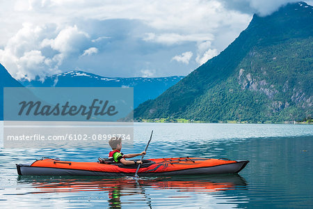 Boy sea kayaking