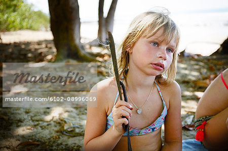Girl in bikini looking away - Stock Photo - Masterfile - Premium
