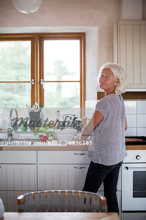 Smiling woman in kitchen