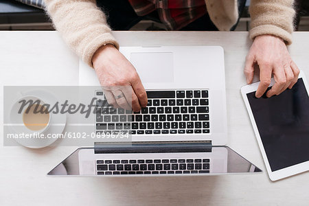 Hands on laptop keyboard