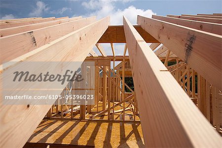 Low angle view of roof rafters of a house
