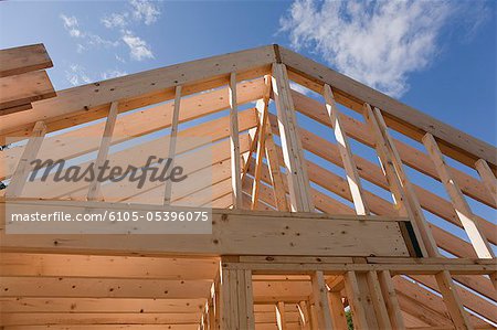 Low angle view of roof framing for a house