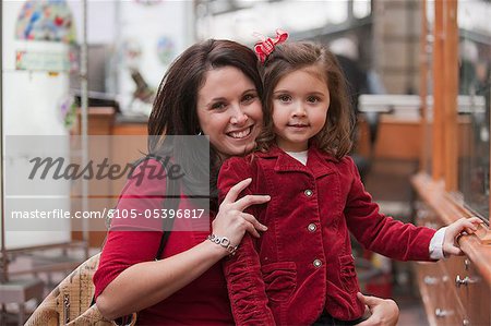 Portrait of a woman smiling with her daughter