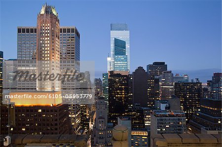 Buildings lit up at dusk downtown Manhattan looking north, New York City, New York State, USA