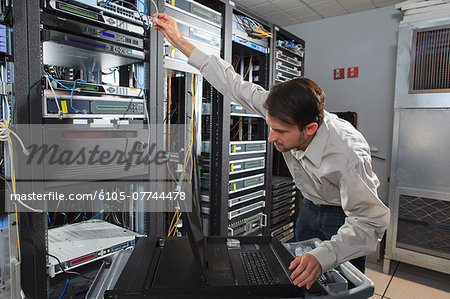 Network engineer configuring a data switch Network engineer configuring a data switch