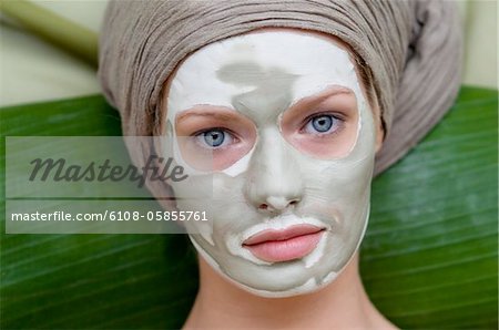 Portrait of a young woman with beauty mask on her face