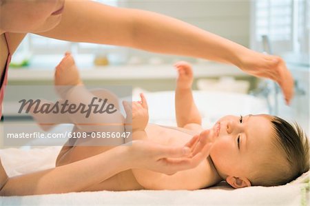 Mother and naked baby, skin care