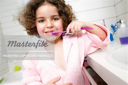 Little girl brushing her teeth