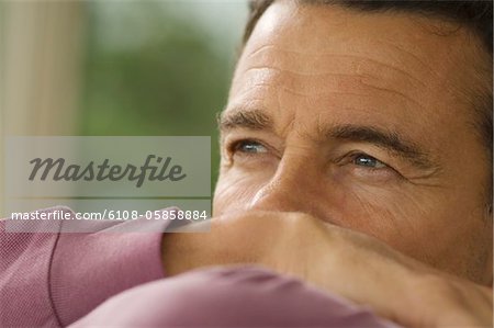 Thoughtful man's portrait, indoors