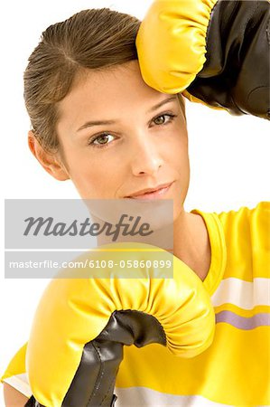 Portrait of a female boxer wearing boxing gloves