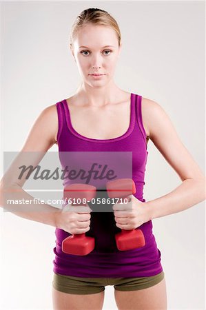 Woman exercising with dumbbells