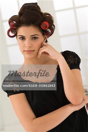 Portrait of a woman with hair curlers in her hair