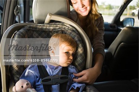 Woman with her son in a car