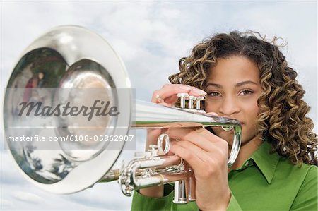 Teen playing trumpet Stock Photos, Royalty Free Teen playing