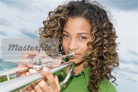 Teen playing trumpet Stock Photos, Royalty Free Teen playing
