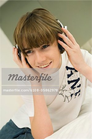 Boy listening to headphones