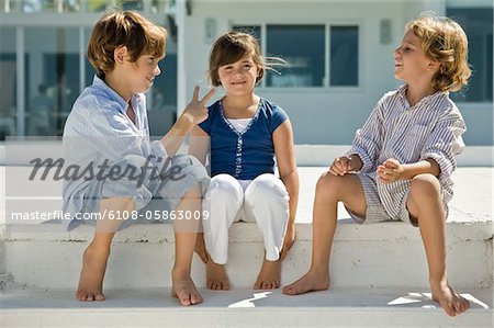 Three children sitting together