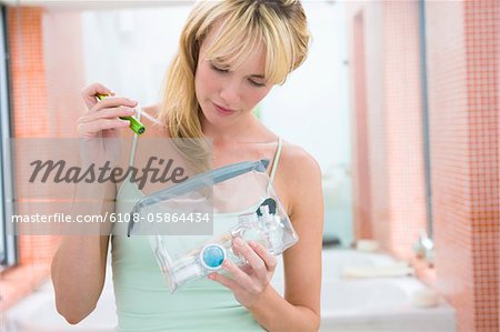 Woman holding a make-up bag