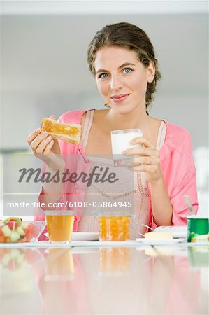 Portrait of a woman having breakfast