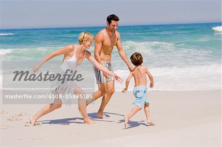 Family playing on the beach