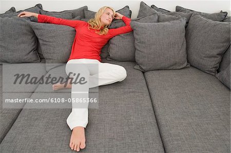 Woman reclining on a couch