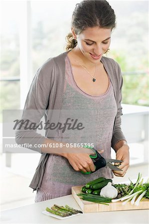 Woman chopping vegetables in the kitchen