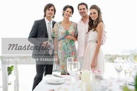 Newlywed couple with their parents