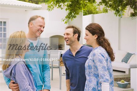 Two couples smiling together