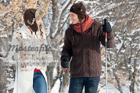 Young couple snowshoeing