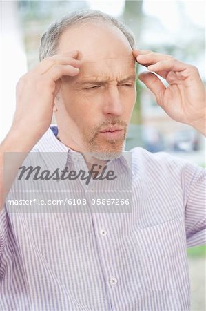 Man suffering from a headache