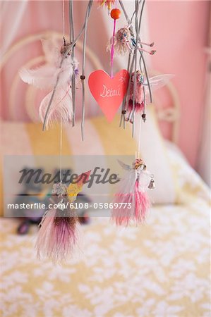 Close-up of wind chime decorated in a bedroom