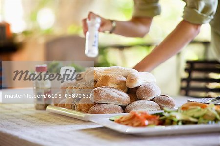 Bread and salad served on a table