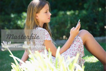 Photo Cute Little Girl Sitting On Stock Photo 128460194