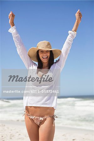 Young woman enjoying on a beach